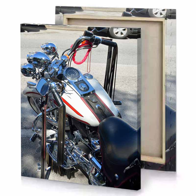 a motorcycle parked on the side of road white smoke canvas