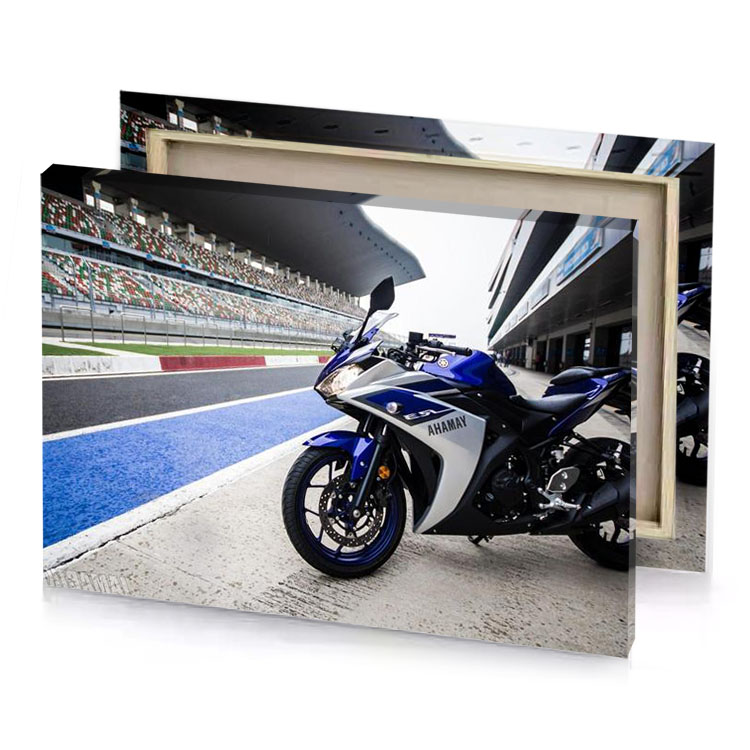 a motorcycle parked on track near stadium light steel blue canvas