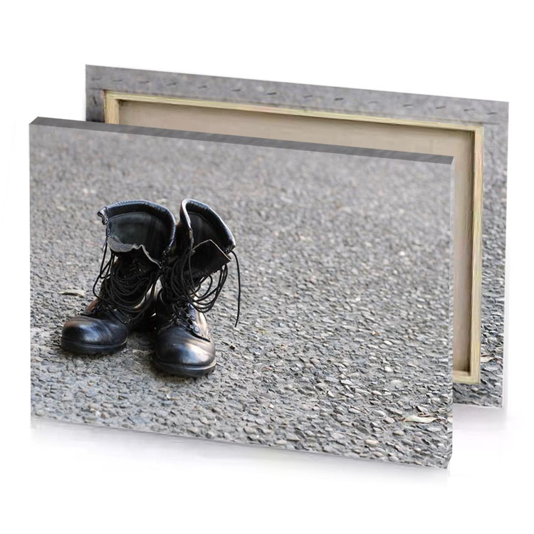 a pair of black boots on the ground smoky canvas