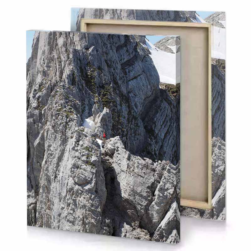 a person climbing mountain on snowboard taupe canvas