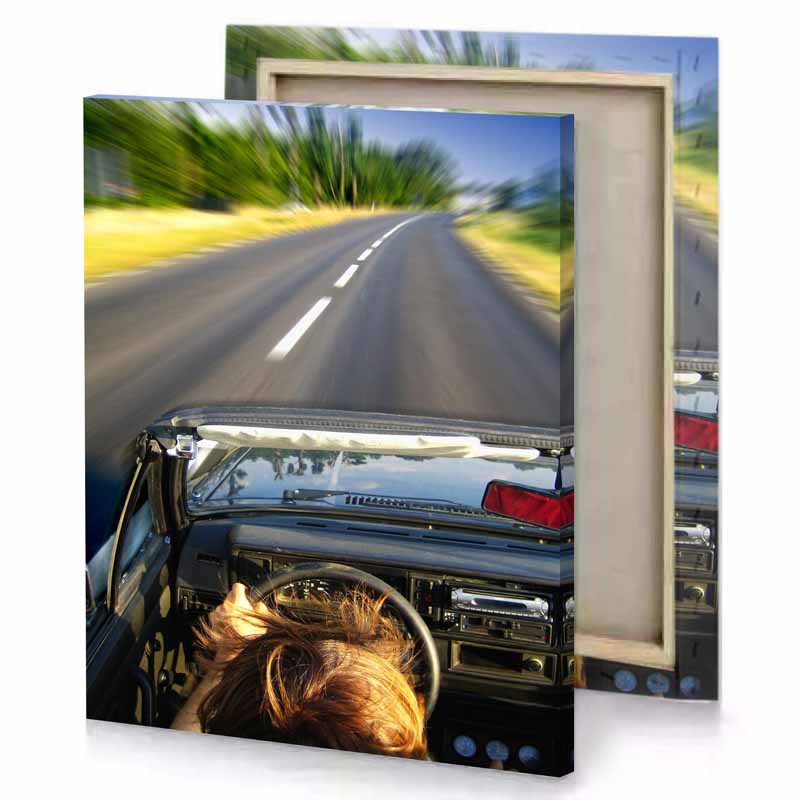a person driving down road with car gray canvas
