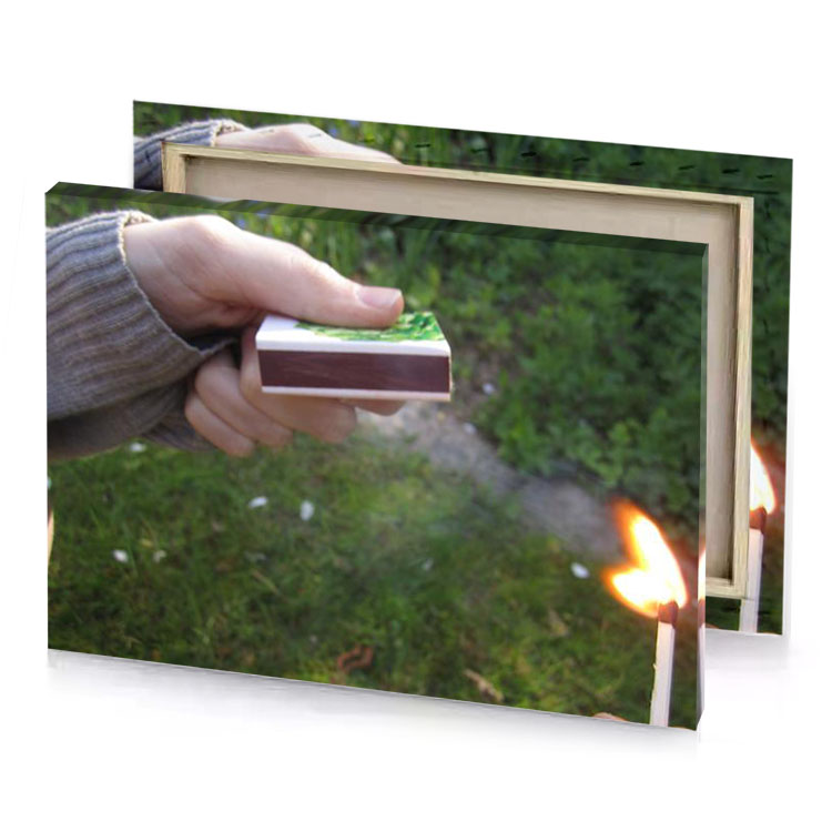a person holding match in their hand hunter green canvas