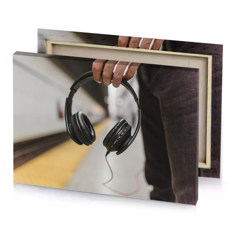 a person holding pair of headphones zinnwaldite brown canvas