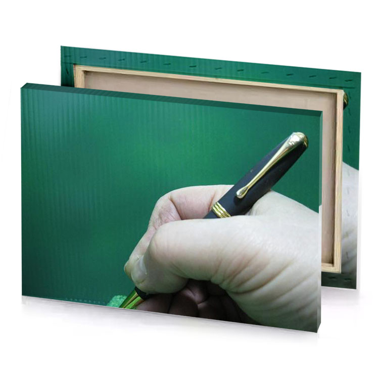 a person holding pen in their hand sea green canvas