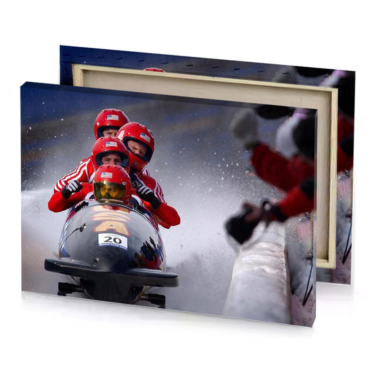a person in red jacket is racing sled burgundy canvas
