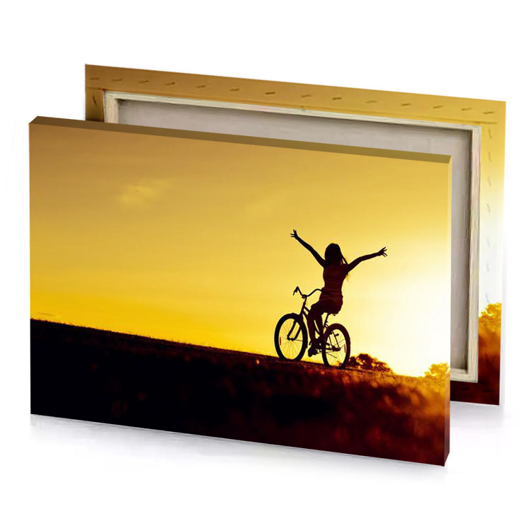 a person riding bike in the sunset yellow orange canvas
