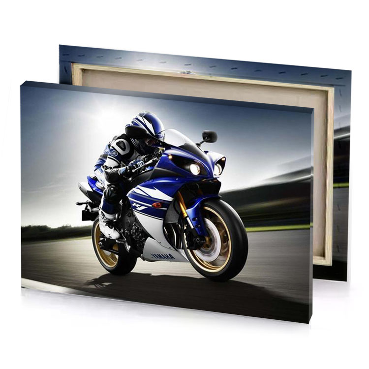a person riding blue motorcycle on track smoky black canvas