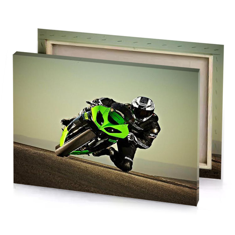 a person riding green motorcycle on road sage canvas