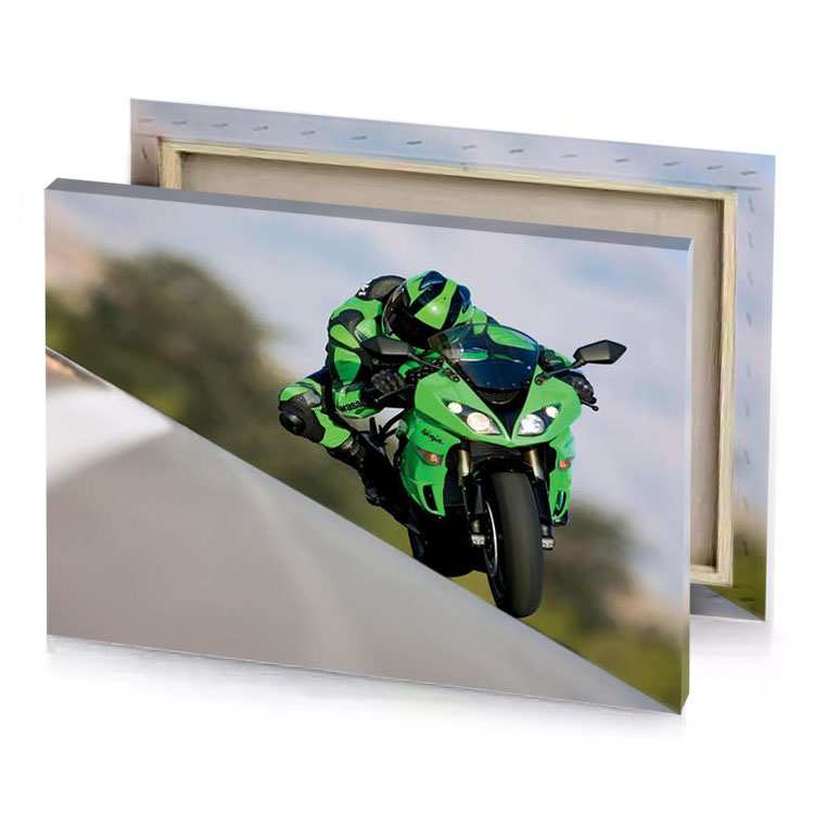 a person riding green motorcycle on road taupe canvas