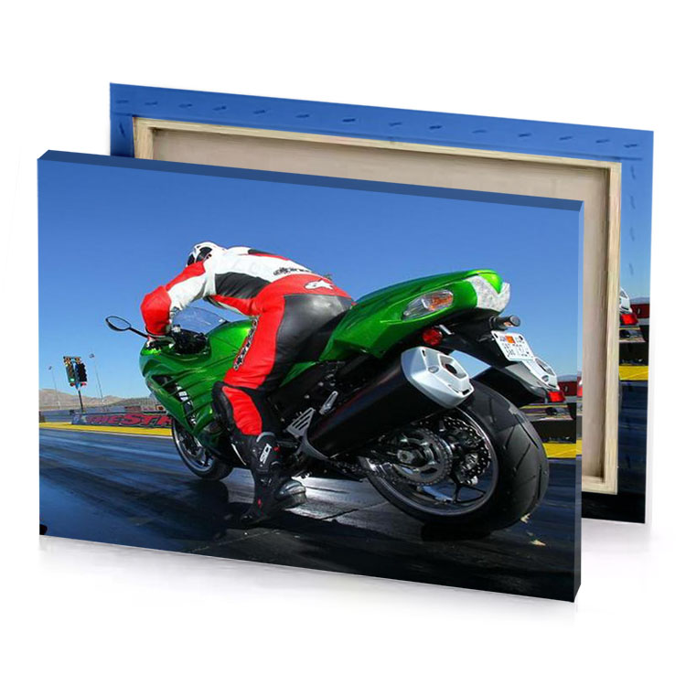 a person riding green motorcycle on track lust canvas