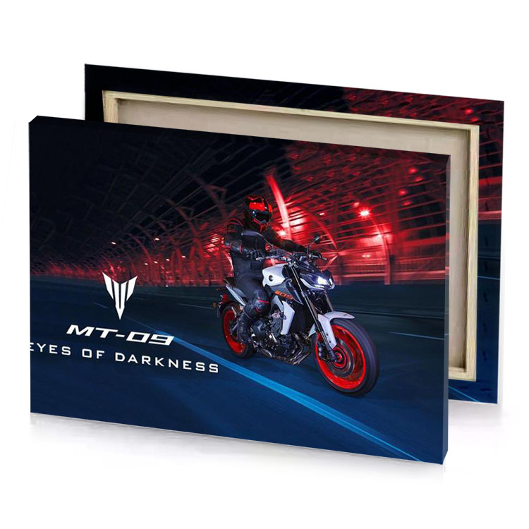 a person riding motorcycle on road at night garnet canvas