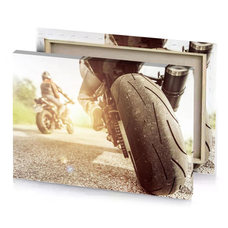 a person riding motorcycle on road garnet canvas