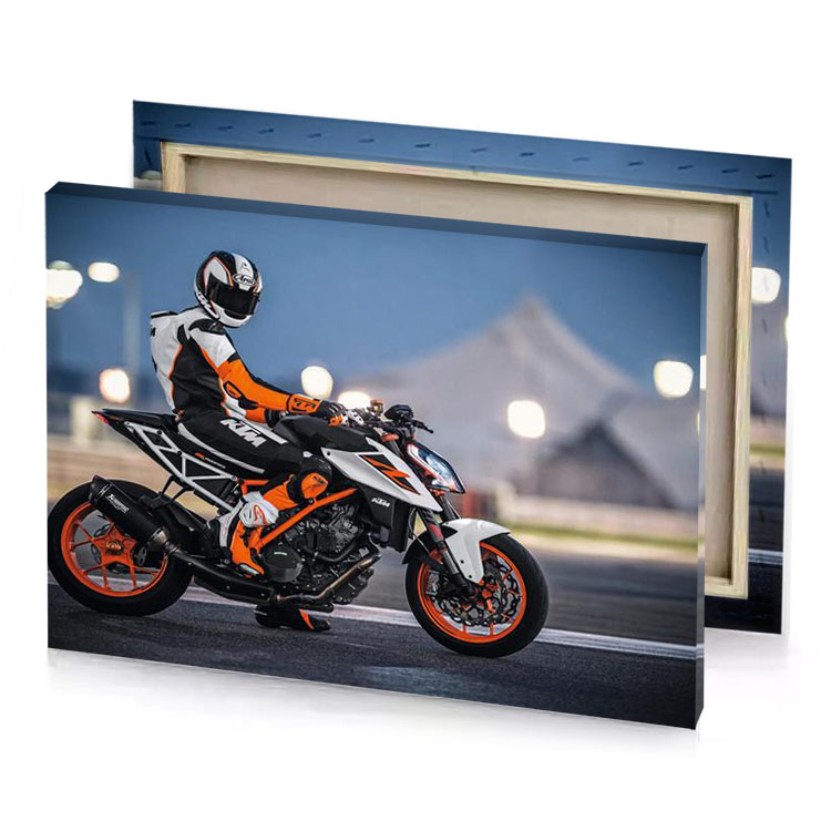 a person riding motorcycle on street manatee canvas