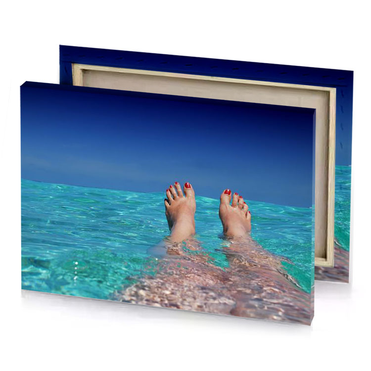 a person s feet in the water steel blue canvas