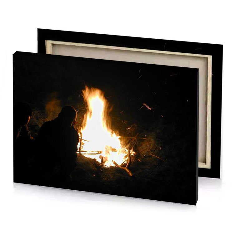 a person sitting in front of fire blanched almond canvas
