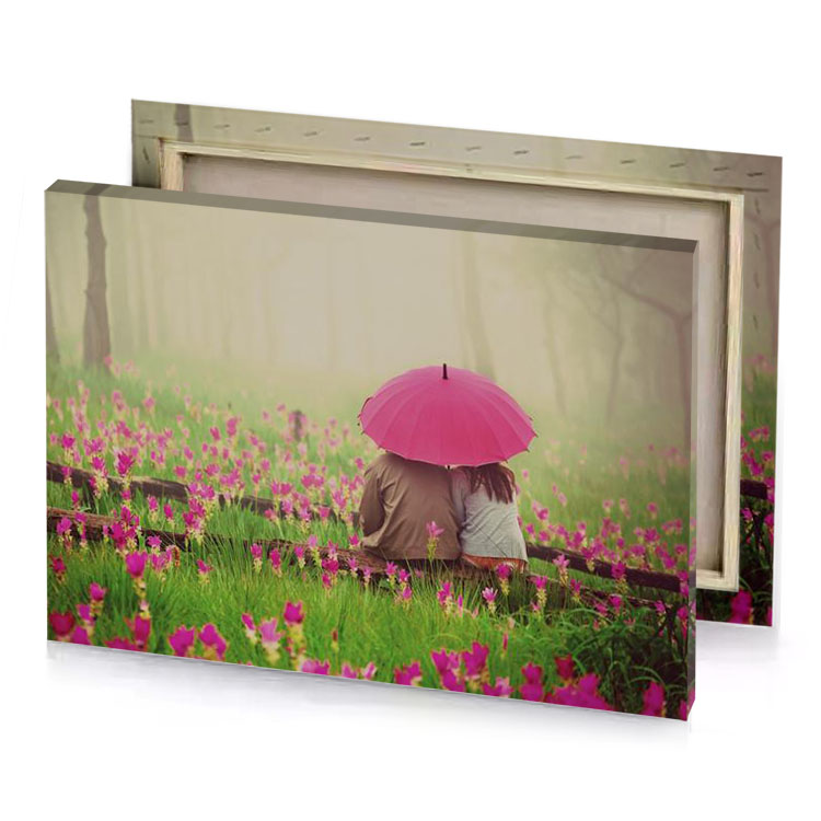 a person sitting in the grass with an umbrella indian red canvas