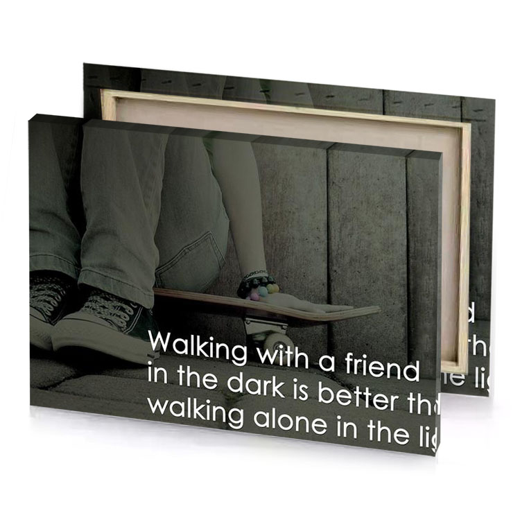 a person sitting on skateboard with quote canvas