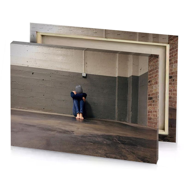 a person sitting on the floor in room canvas