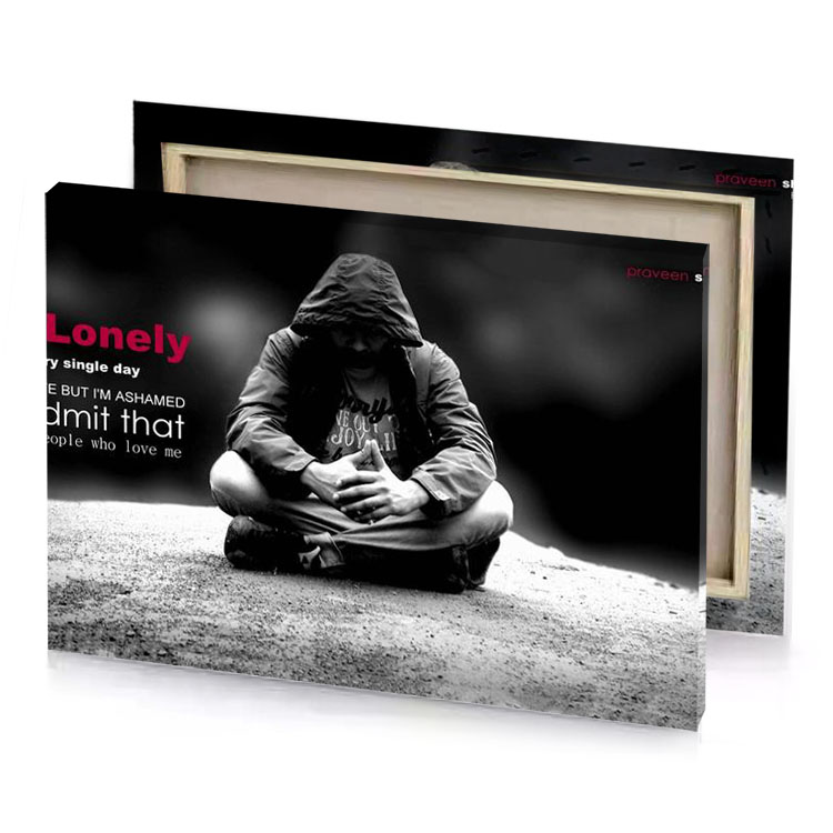 a person sitting on the ground with their hands clasped canvas