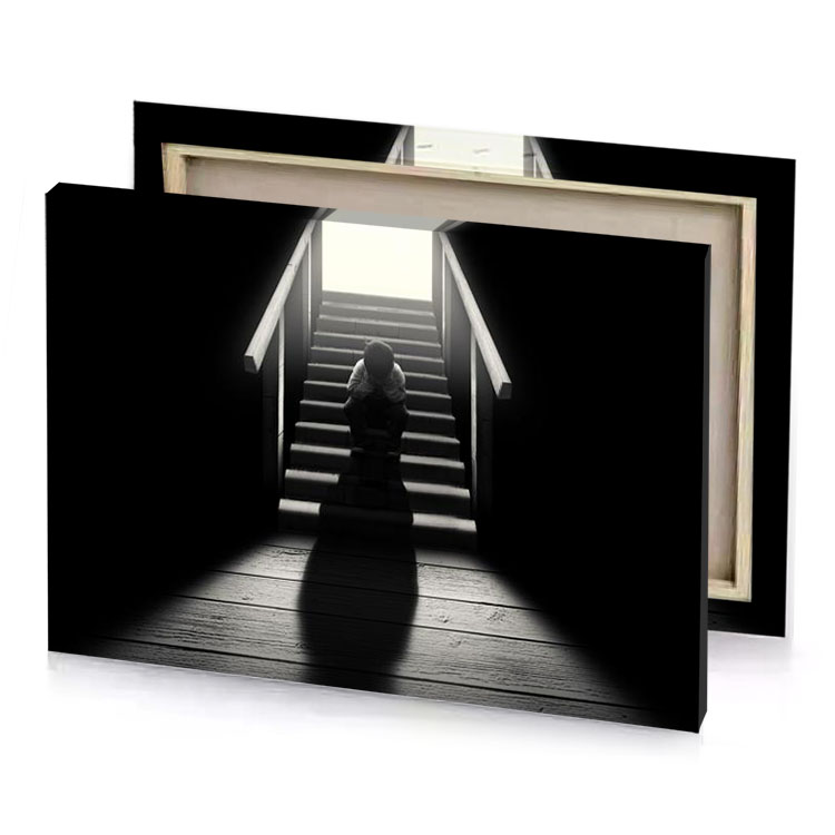 a person sitting on the stairs of house gray canvas