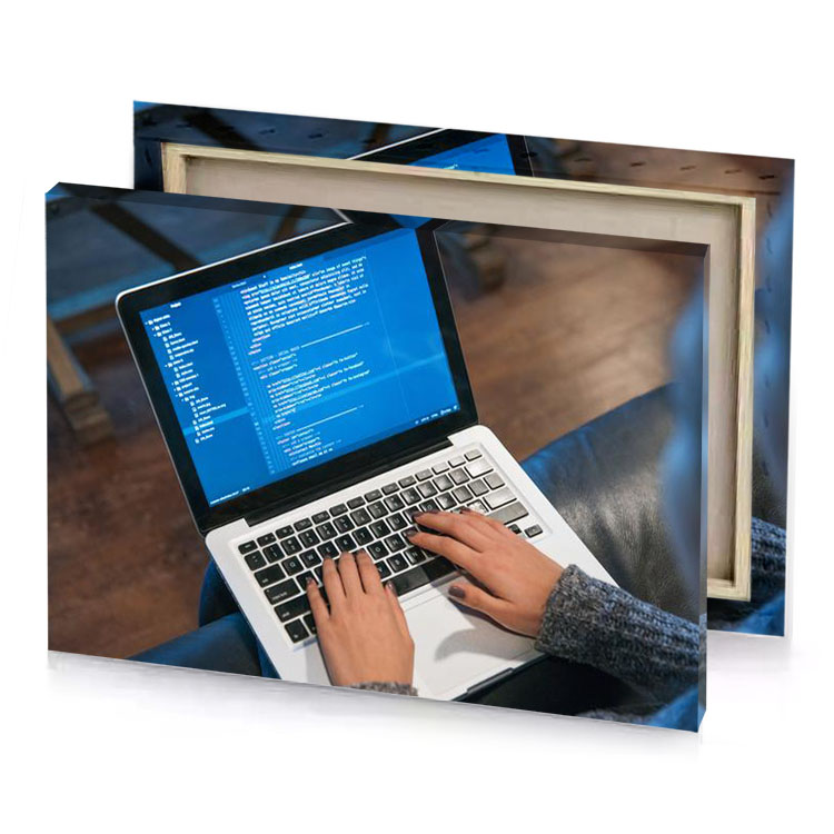 a person typing on laptop denim blue canvas