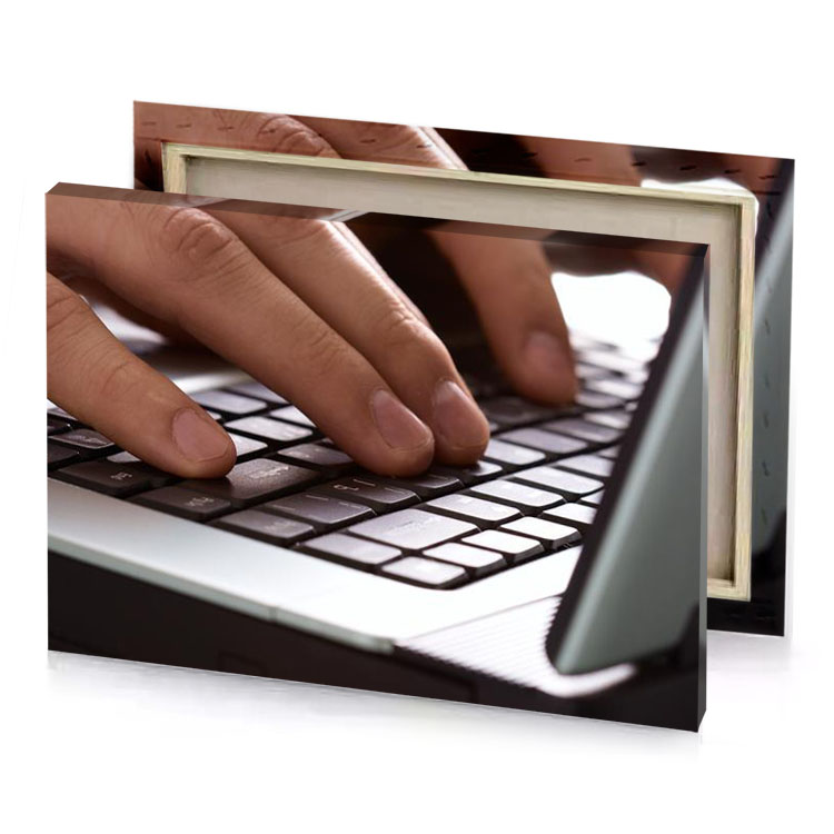 a person typing on laptop keyboard garnet canvas
