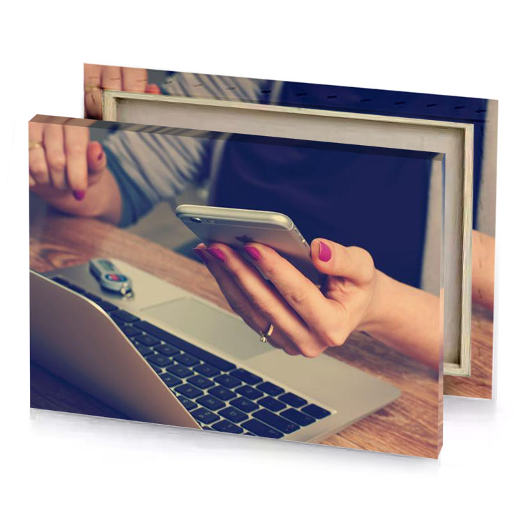a person using cell phone on laptop sapphire canvas