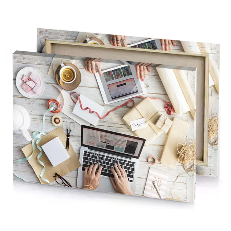 a person using laptop computer surrounded by wrappings and gifts rose quartz canvas