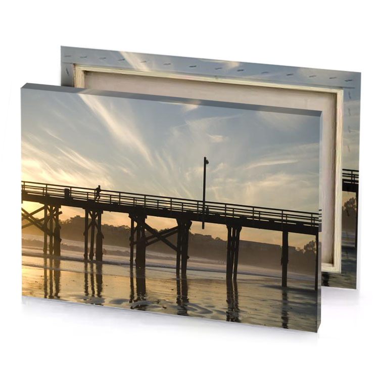 a person walking on pier at sunset tan canvas