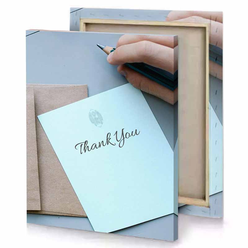 a person writing on piece of paper light cyan canvas