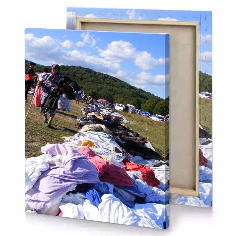 a pile of clothes is piled up on the grass camouflage green canvas