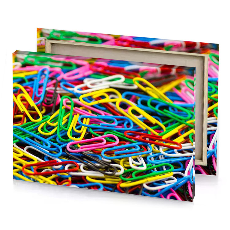 a pile of colorful paper clips canary yellow canvas