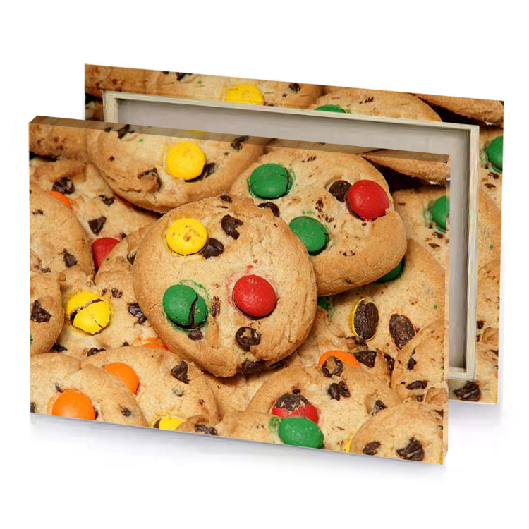 a pile of cookies with m and on them fern green canvas