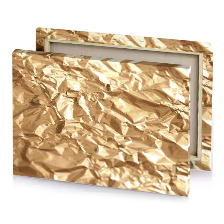 a pile of crumpled gold foil papaya whip canvas