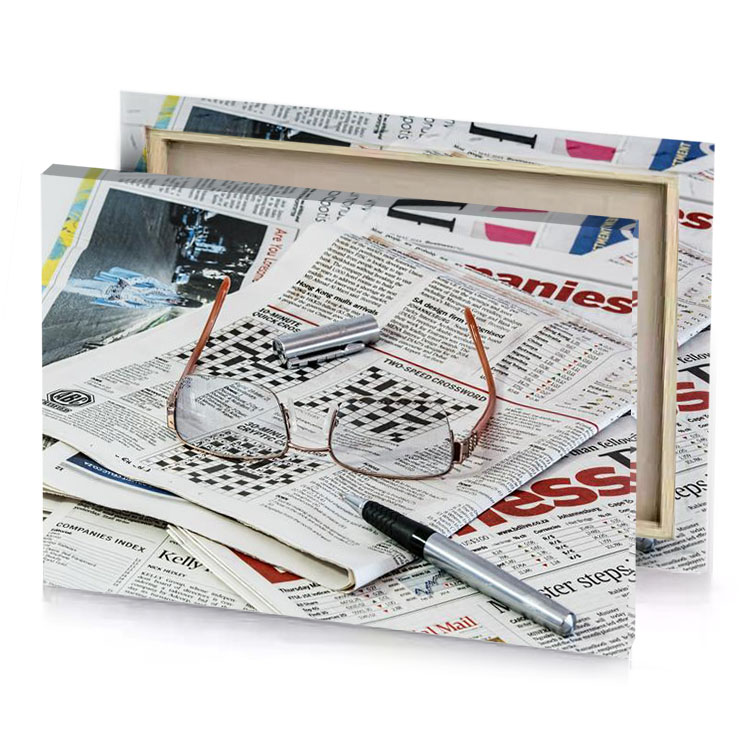 a pile of newspapers with glasses on top silver canvas
