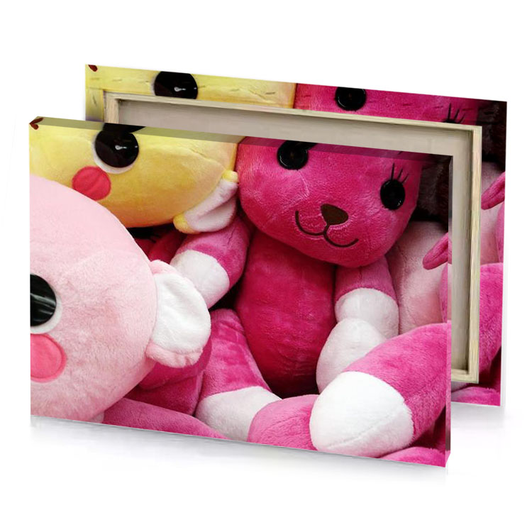 a pile of pink and yellow teddy bears brown canvas
