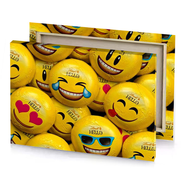 a pile of smiley face chocolates golden poppy canvas