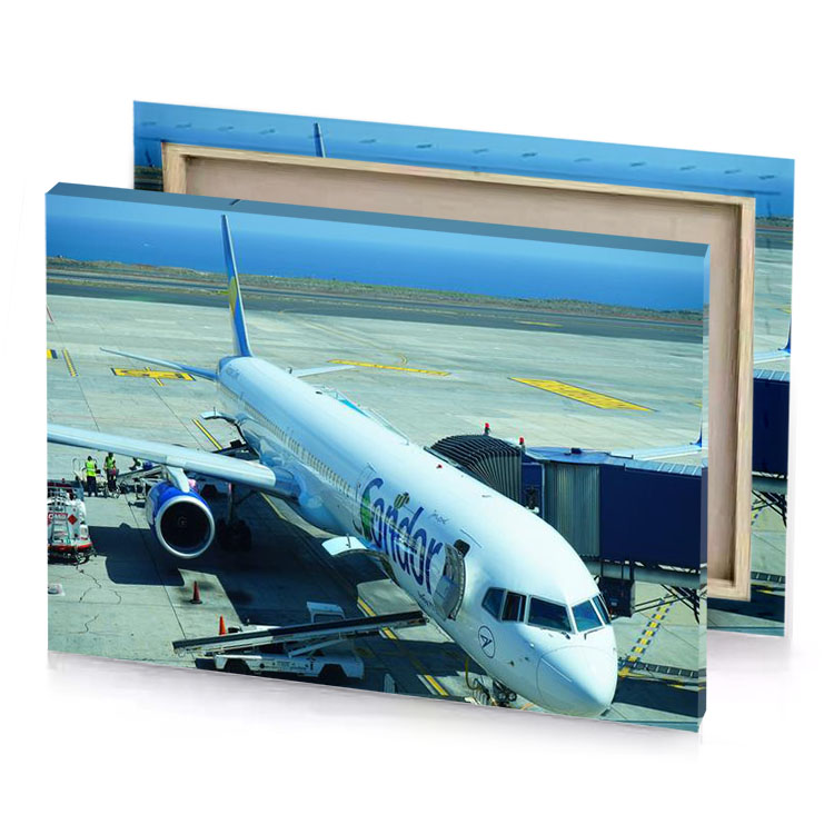 a plane is parked on the tarmac light steel blue canvas