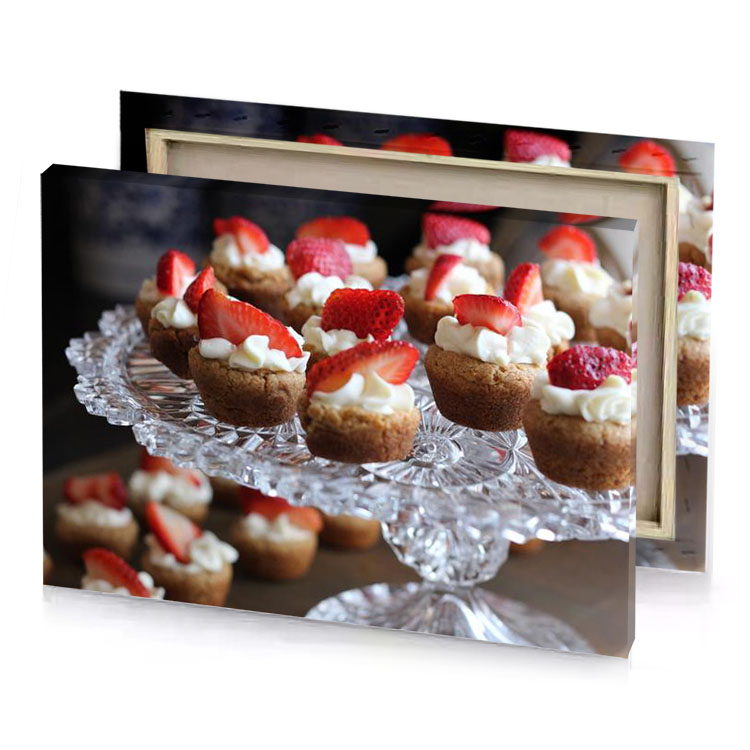 a plate of mini desserts with strawberries and brown canvas