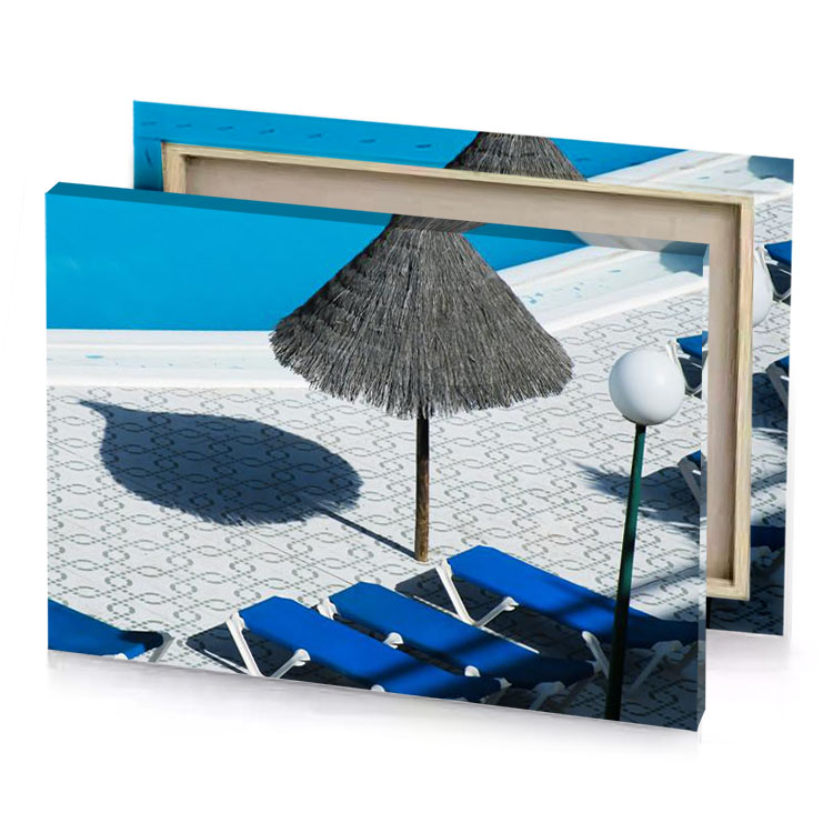 a pool with blue chair and straw umbrella charcoal canvas