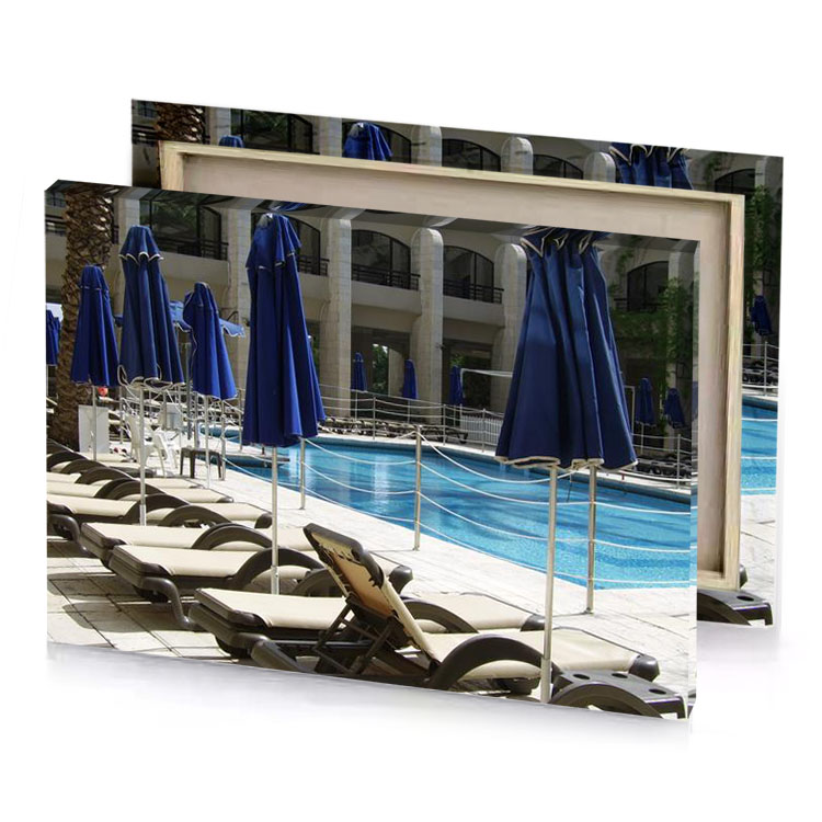 a pool with chairs and umbrellas moonstone blue canvas
