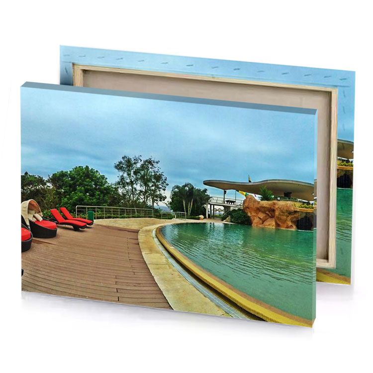 a pool with waterfall and in the middle fern green canvas