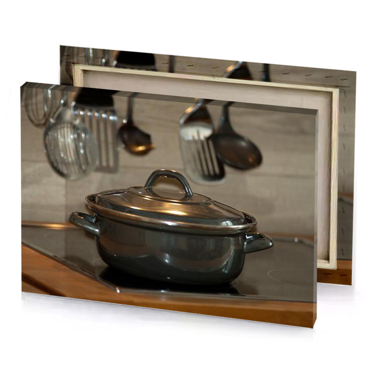 a pot on stove with spoons and uts hanging from bistre canvas