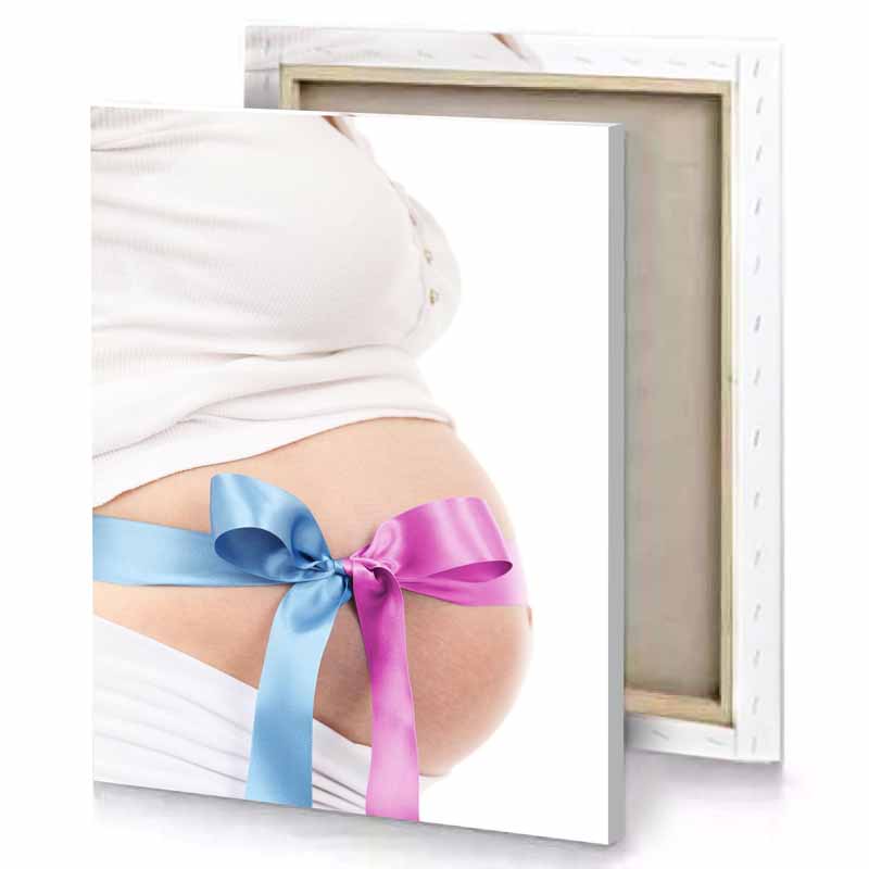 a pregnant belly with blue ribbon around it apricot canvas