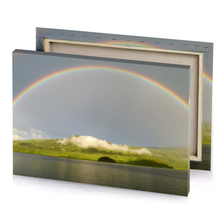 a rainbow appears over lake with mountain in the background manatee canvas