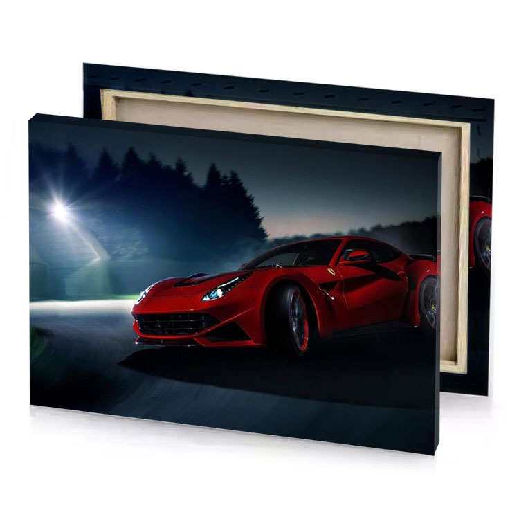 a red ferrari car driving on road at night maroon canvas