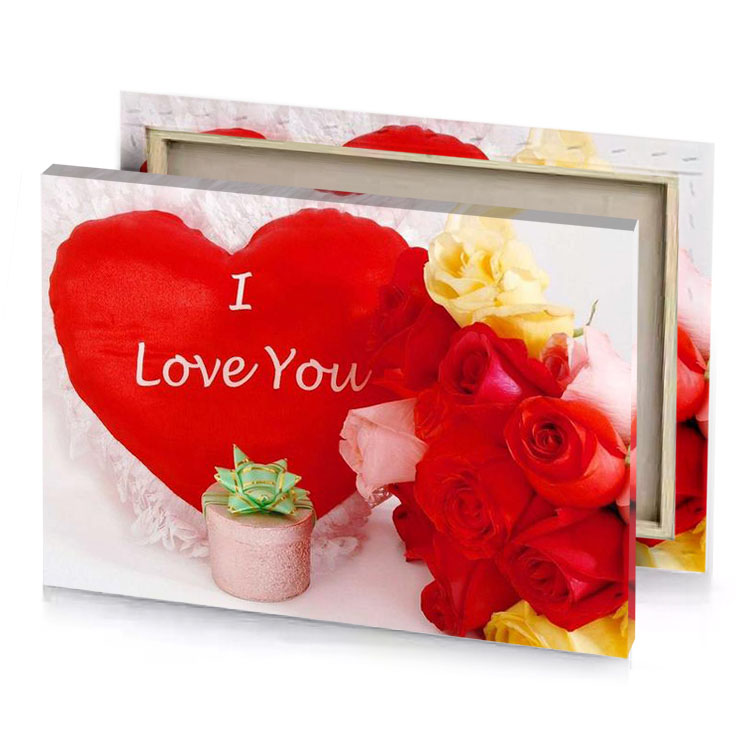 a red heart with white writing on it spanish canvas
