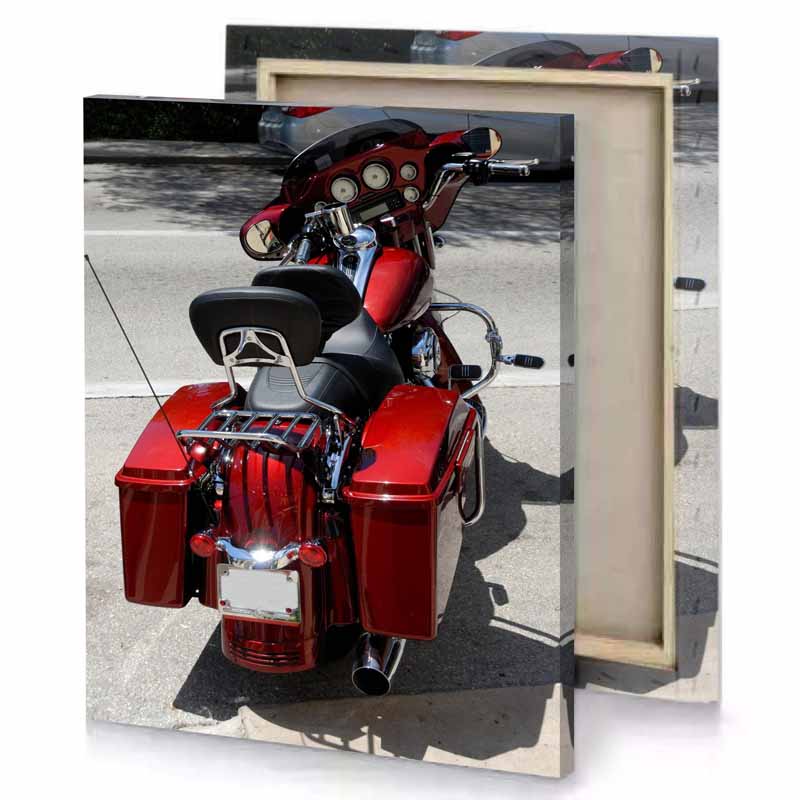 a red motorcycle parked on the side of road firebrick canvas