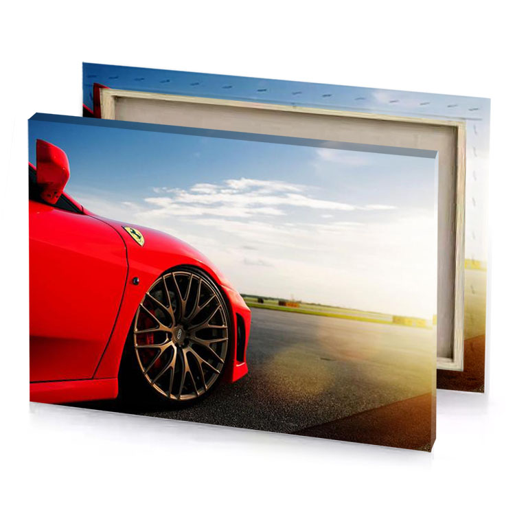 a red sports car parked on road canvas
