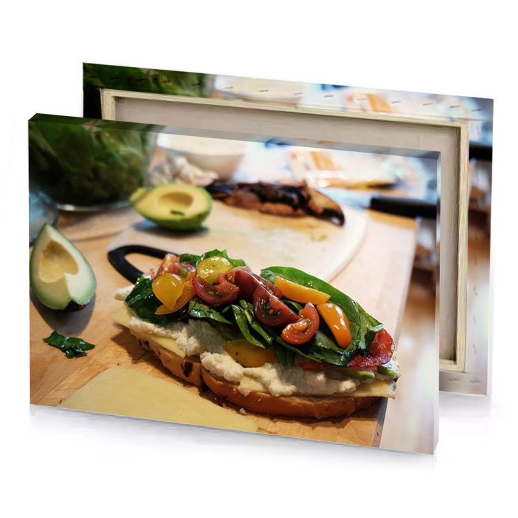 a sandwich with tomatoes cheese and spinles sepia canvas